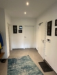 Moderner Flur mit Teppich - Zweitbezug! Stylische 3-Zimmer-Wohnung mit Einbauküche in Neuenkirchen-Vörden.