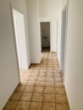 Heller Flur mit Fliesenboden - Gemütliche 3-Zimmer-Wohnung in Badbergen zu vermieten!