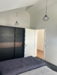 Schlafzimmer mit Kleiderschrank