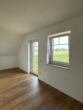Helles Wohnzimmer mit Terrasse - Helle 3-Zimmer-Wohnung mit Balkon in Neuenkirchen
