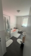Helles Badezimmer mit Dusche - Helle 2-Zimmer-Wohnung mit Terrasse und Garten in Ankum