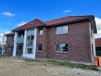 Ziegelhaus mit Balkon - Moderne 2-Zimmer-Wohnung mit Terrasse in beliebter Lage von Quakenbrück