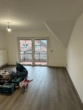 Helles Wohnzimmer mit Balkon - Geräumige 3-Zimmer Wohnung im Ortskern von Neuenkirchen/Br. zu vermieten!