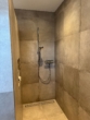 Moderne Dusche mit Fliesen - Moderne 3-Zimmer-Wohnung mit Balkon in Alfhausen